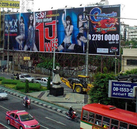These Bangkok drivers may have been distracted by the billboard of the 'pole dancer'