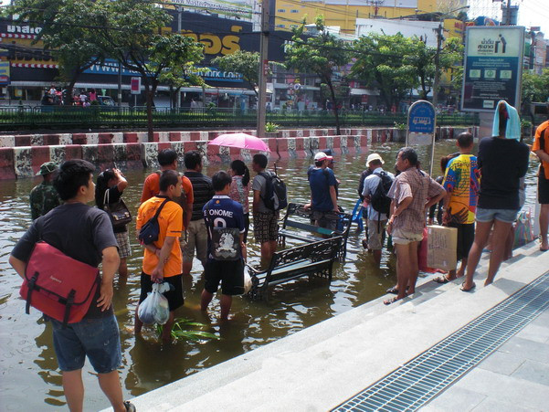 Waiting for the bus at Central Ladprao - yes, in mid-thigh water, buses are still running