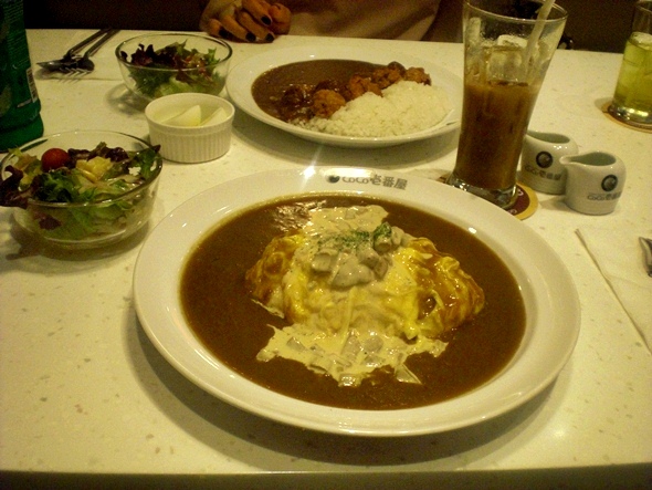 My mushroom and omelette curry with my friend's pork ball curry in the background -- their curries look a little sloppy but they are delicious.