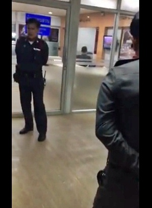 Thai police attempting to extort money out of a mall cashier.