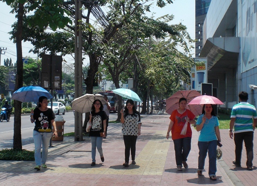 Thai girls with umbrellas