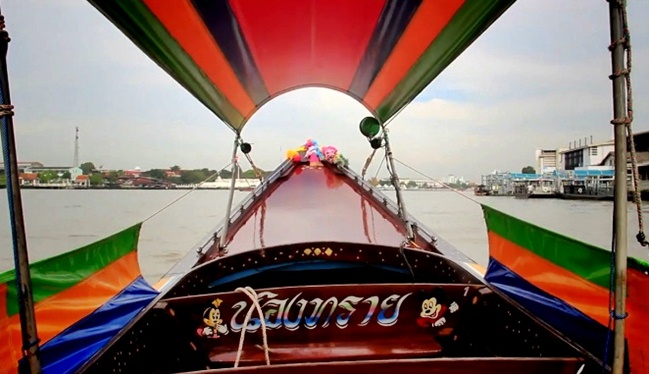 take a longtailed boat on chao praya river bangkok