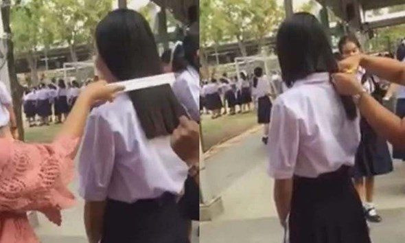Thai teacher cuts students hair as it is too long