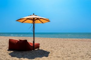empty beach thailand umbrella